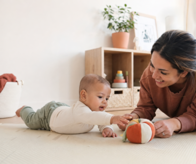 Mother and baby enjoying supervised floor play with age-appropriate toys