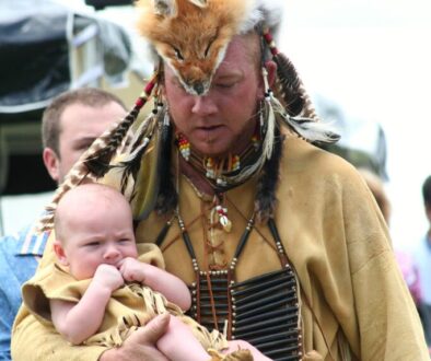 Parent holding a baby during a warm face-to-face interaction