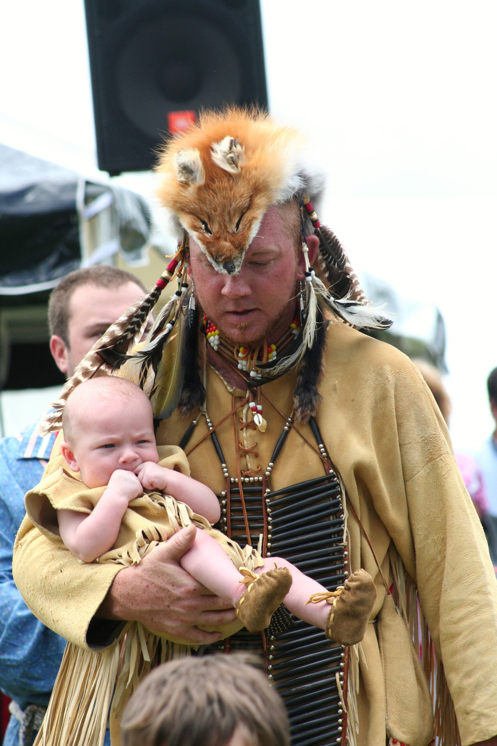 Parent holding a baby during a warm face-to-face interaction