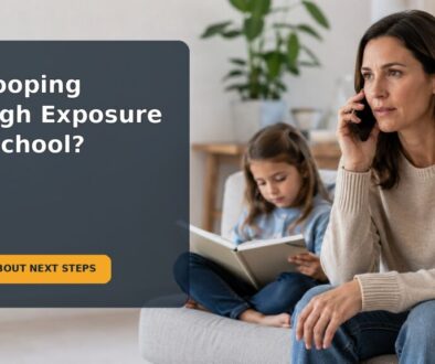 A parent checks a school health notice with their school-age child at home