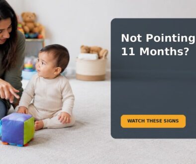 A parent and an 11-month-old baby sharing attention with a toy during floor play