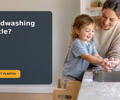 A caregiver helps a toddler wash their hands safely at a bathroom sink