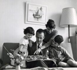 Parents and two children spending calm time together at home
