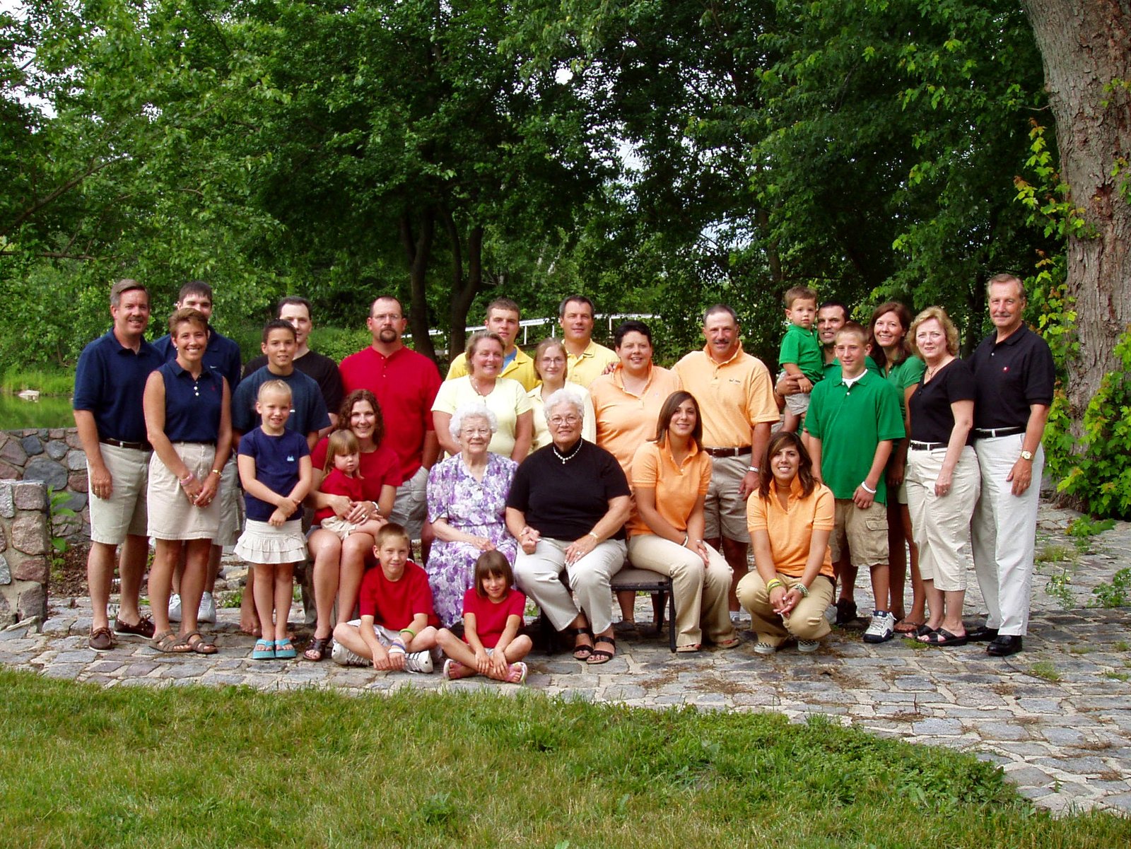 An extended family spanning four generations, used to illustrate respectful parenting boundaries with grandparents.