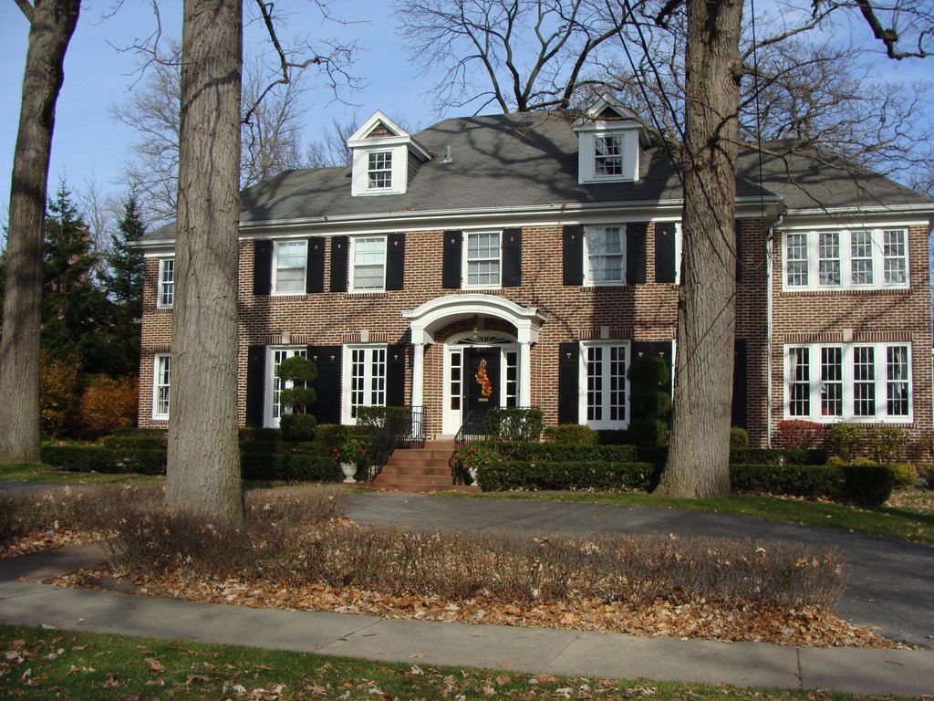 Exterior view of a family home, used as an editorial illustration for an article about preparing an older child to be home after school.