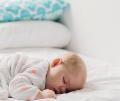 A baby sleeping peacefully in a crib