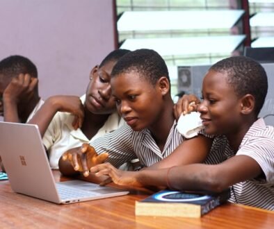 Students using a laptop together, used as a CC0 editorial illustration for a school Chromebook eye-strain check.