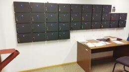A row of locked firearm storage safes at a courthouse.